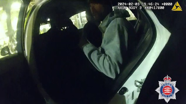 Warren, shown as he was being arrested, claimed the dogs had been properly registered