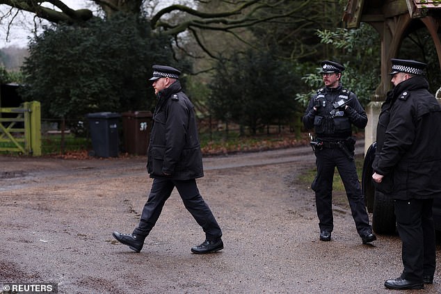 Police officers at the entrance to the Wood Farm on the Sandringham Estate