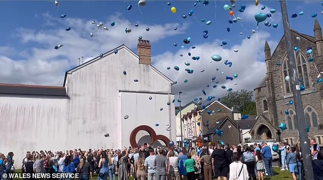 Pictured here are friends and family attending a balloon release to commemorate the passing of Harvey