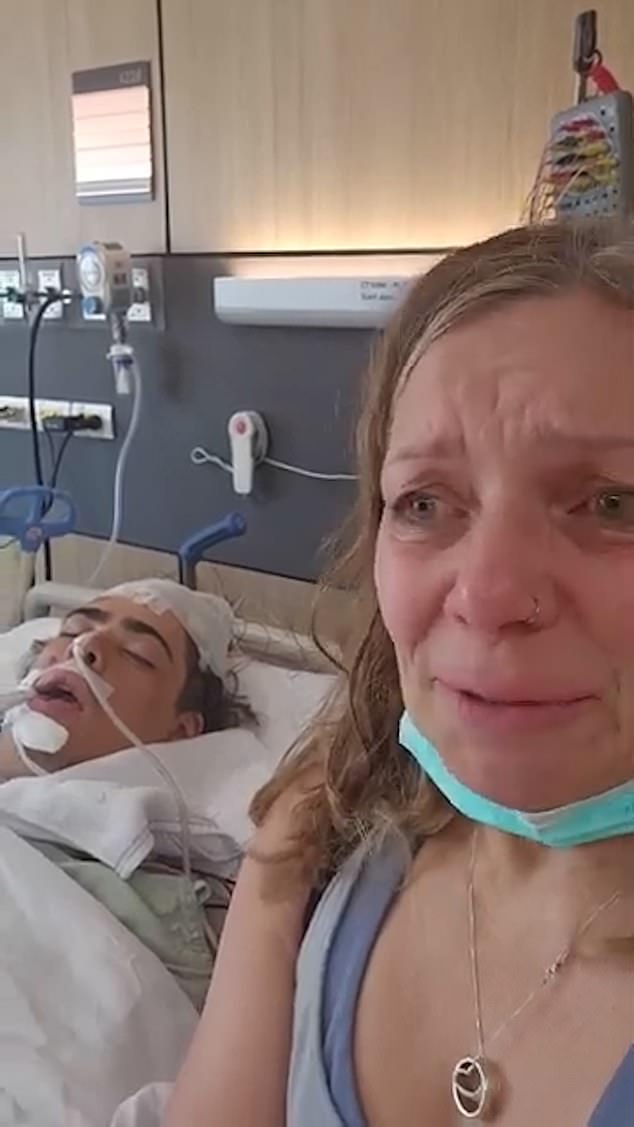 Neonatal nurse Lisa Duggan at her son Tiger's bedside in the Med Park Hospital, Bangkok