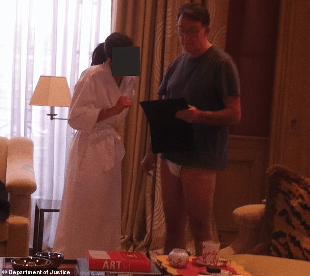 A photograph released as part of the 'Epstein files' apparently shows Lord Mandelson talking to a woman who is wearing a white bath robe
