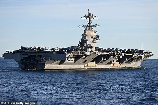 The world's largest aircraft carrier USS Gerald R Ford is among the military armada moving into the Middle East