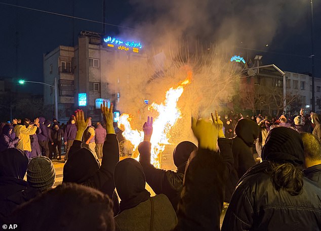 Iranians attend an anti-government protest in Tehran on January 9