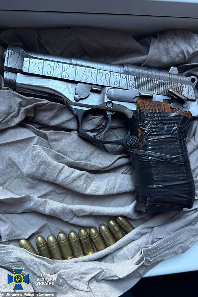 A gun seized by officers as part of the raid on a Russian hit squad accused of plotting high-profile assassinations in Ukraine