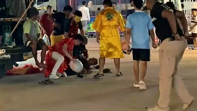 Officers launched an undercover operation near a temple area, posing as members of a traditional lion dance troupe to bled in with the crowded festival setting