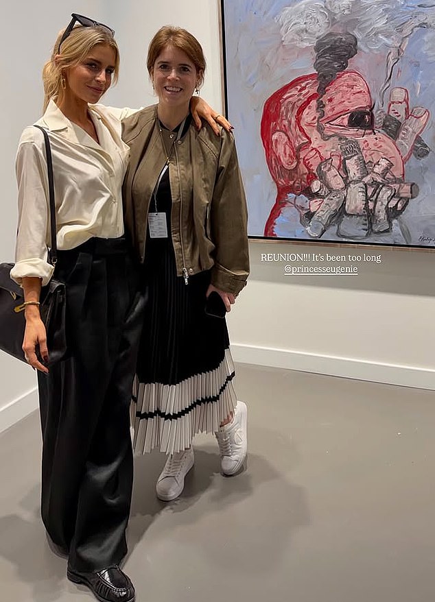 Eugenie is pictured with friend Caroline Daur, 30, working at an art fair in Qatar last week