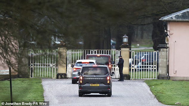 Vehicles are seen arriving at Royal Lodge at Windsor Castle, Berkshire, on Friday morning