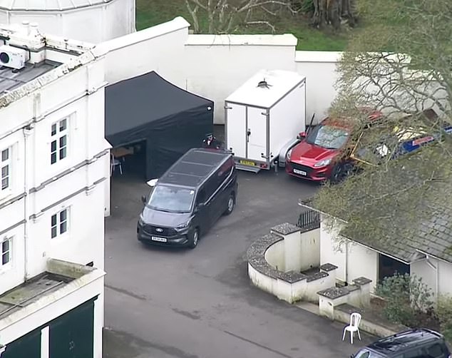 Police vehicles are seen at Royal Lodge in Windsor on the morning of Friday 20 February 2026