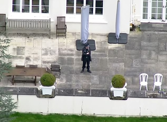 An aerial view of police visiting Royal Lodge in Windsor, Berkshire, on Friday