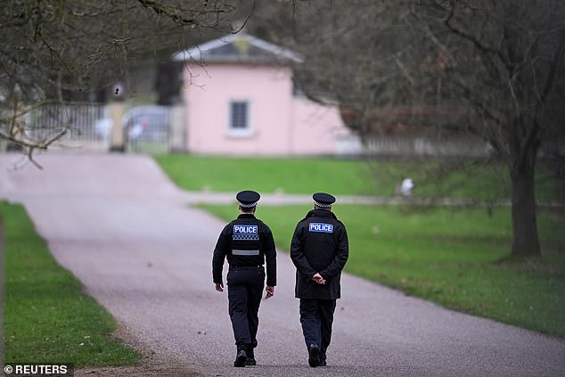 Police officers patrolling Royal Lodge. On Friday night Scotland Yard told staff closest to the disgraced former prince to 'consider carefully anything they saw or heard' while working for him