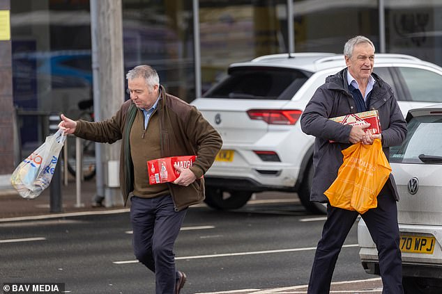 Andrew's security team stock up on lager and noodles after driving him home from police station following arrest