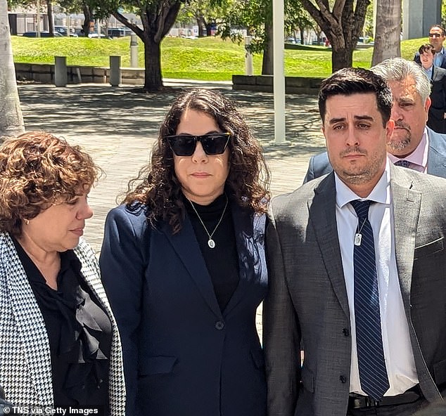 Angulo (far right) and Benavides Leon's family sued the Tesla driver, George McGee, and Tesla for the incident. McGee settled but the lawsuit against Tesla went to trial last year. Angulo is pictured with Naibel Benavides Leon, his girlfriend's sister, outside of court
