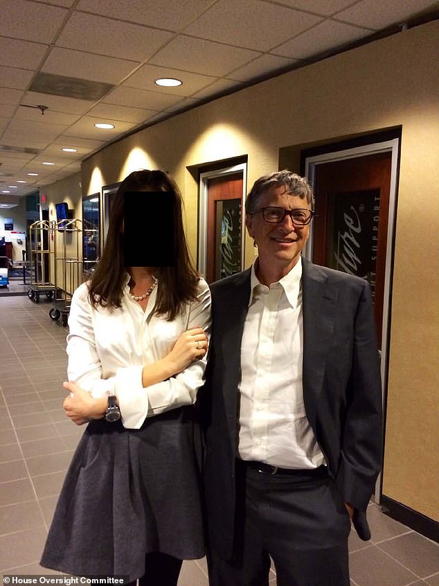 Billionaire Bill Gates next to a woman whose face has been redacted. Gates was a regular visitor to Epstein's Manhattan townhouse and maintained a relationship with the pedophile for years despite his 2008 conviction for soliciting sex from a minor, with the pair photographed together in 2011