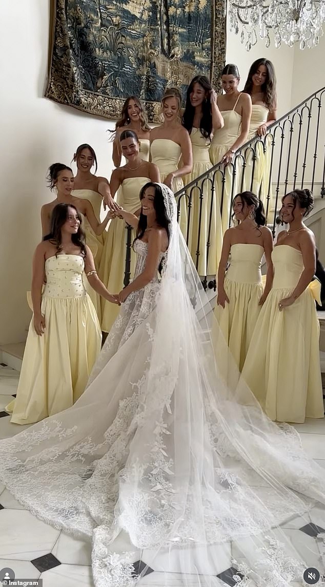 Bride Jess Leis and her 11 bridesmaids pictured at her wedding at La Gemme Estate, a French château in the Southern Highlands, late last month