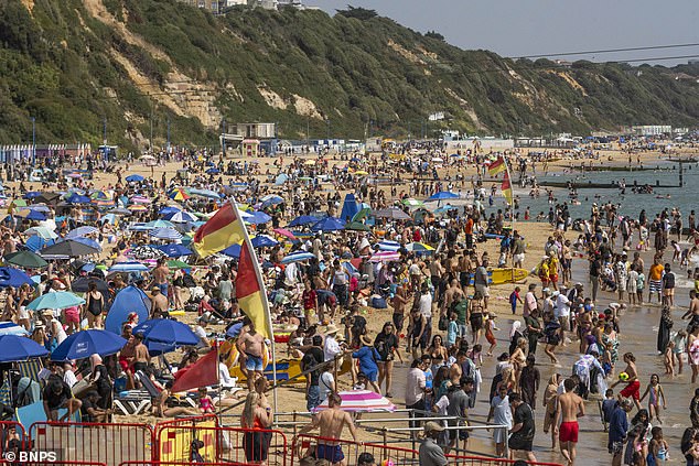 Sun seekers at Bournemouth Beach last year. Parts of the south of England could see the hottest temperature of the year so far
