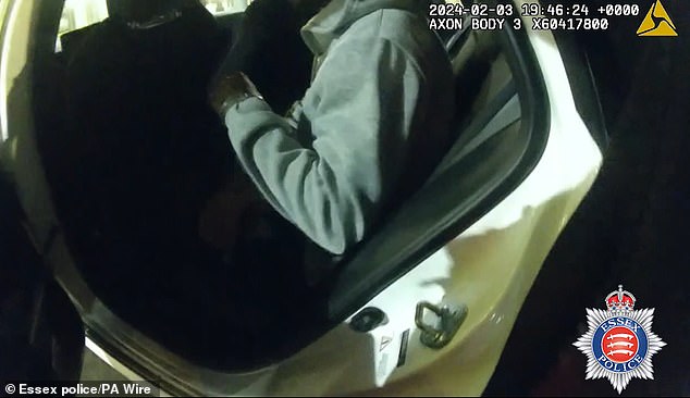 Warren, now of Addlestone, Surrey, was found guilty of owning or being in charge of one of the dogs and possessing a knife at Chelmsford Crown Court on Thursday. Pictured: Bodycam footage of Warren's arrest