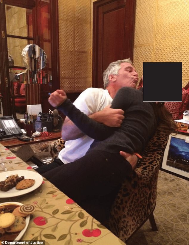 Epstein grabs a woman's backside as she writhes around in his arms at his Manhattan townhouse. The same chair is seen in the photo of Andrew kneeling over the woman