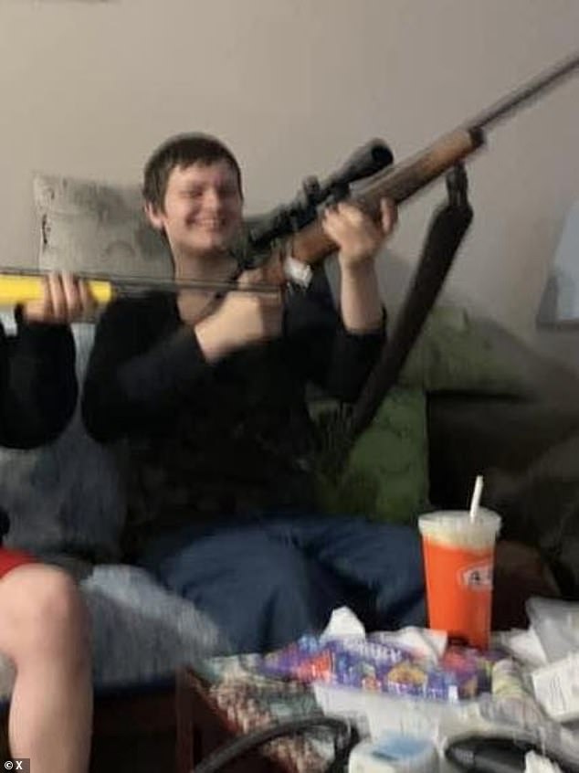Van Rootselaar seen pictured happily gripping a rifle