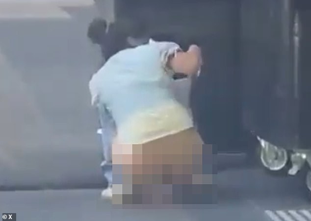 'When you've gotta go': Woman caught pooing on the street in Melbourne CBD by motorist - but opinion is divided over who is more rude