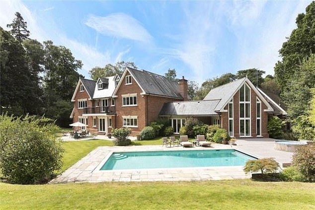 Sir Mo Farah finally sells three-storey Surrey home that languished on the market for more than a year - after slashing the price by £1.25million