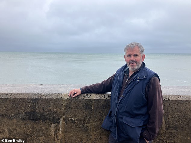 Mr Wilson who runs a nursery and has displayed his flowers at the Chelsea Flower show said: 'People outside of Torcross think it's just a road but they don't understand the importance but for this community that road is a lifeline'