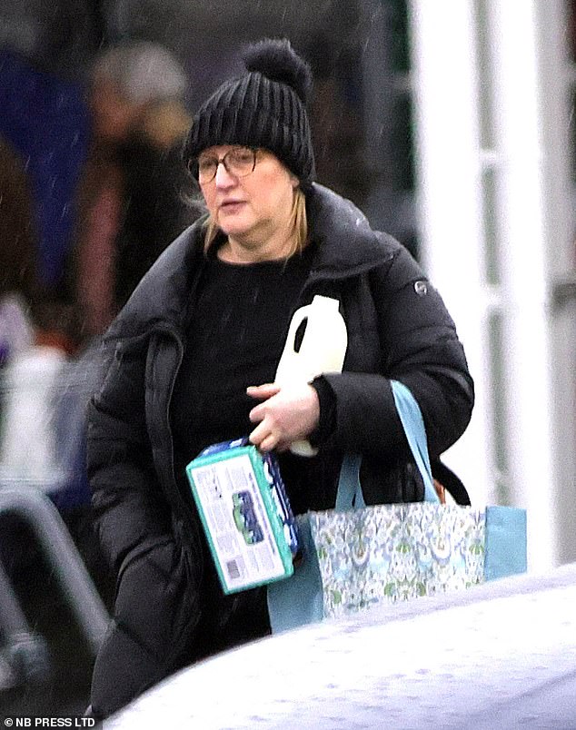 After she was freed from prison she returned to her seaside bolthole in pursuit of quiet anonymity. Pictured: Jane Andrews clutches her shopping in February 2026