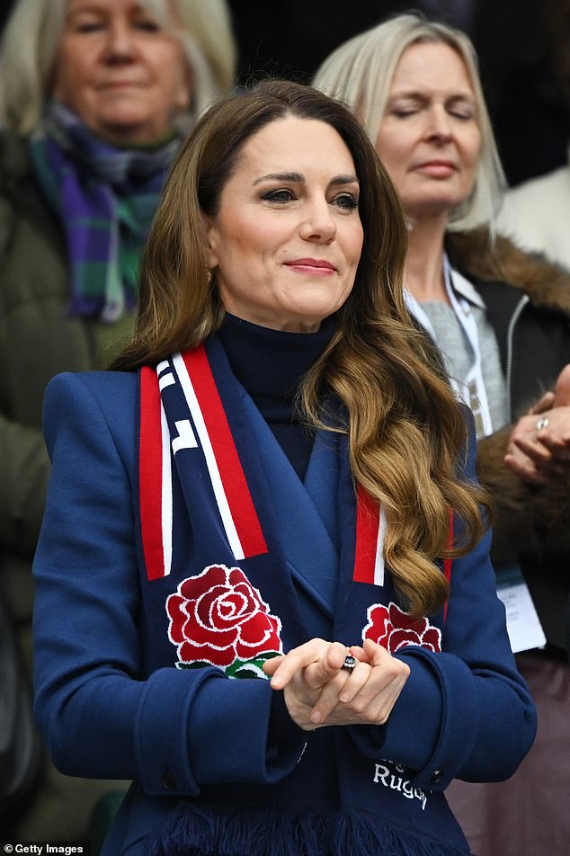 The princess dressed in a long blue coat and wore a matching England scarf around her neck