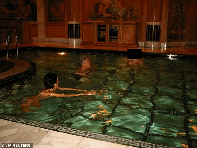 Clinton in a swimming pool with Ghislaine Maxwell in a photo released in December by the Justice Department. Another woman in a bikini is also in the pool with the pair