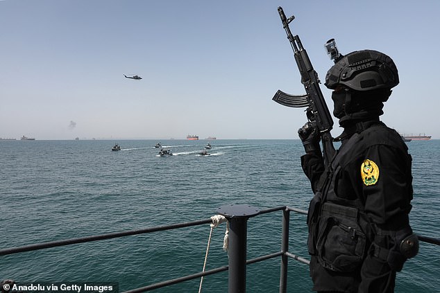 Naval units from Iran and Russia simulate the rescue of a hijacked vessel during the joint naval drills held at the Port of Bandar Abbas near the Strait of Hormuz in Hormozgan, Iran on February 19, 2026