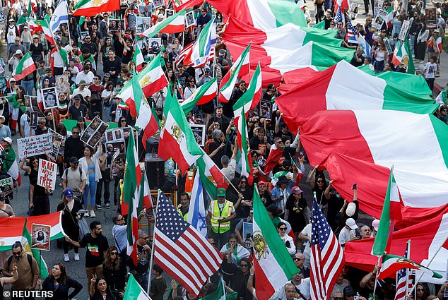 People take part in a rally in support of Iranian protesters during a global day of action in Los Angeles, California, US, February 14, 2026