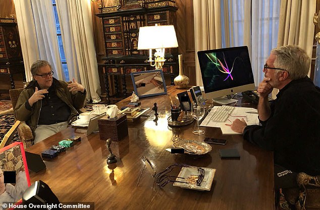 Epstein is seated at his desk opposite right-wing political strategist Steve Bannon at the late pedophile's Manhattan townhouse