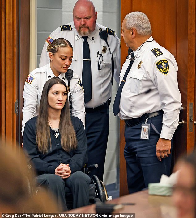 Wheelchair-bound mom accused of killing her three children is pushed into court wearing cross around her neck after suicide attempt left her paralyzed