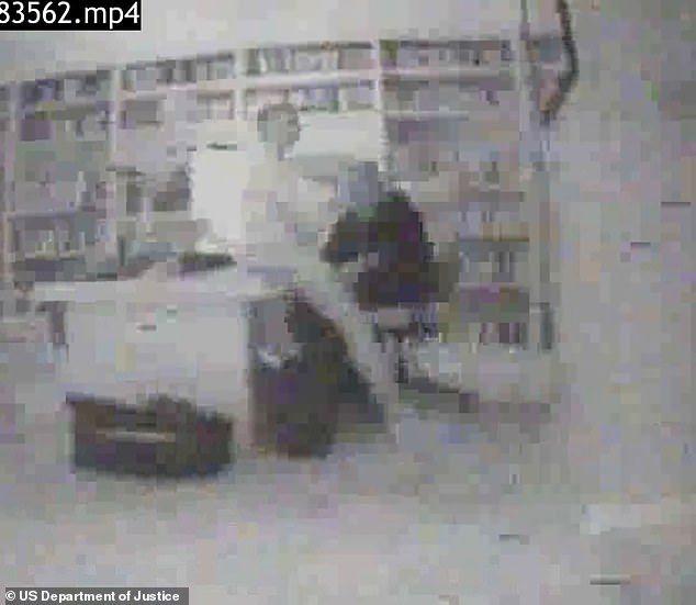 Another clip appears to show a woman on Epstein's desk while he sits in a chair next to her