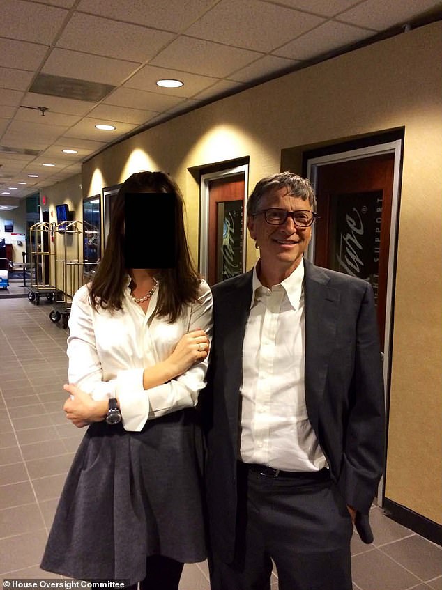 Billionaire Bill Gates next to a woman whose face has been redacted, photographed together in 2011. Gates was a regular visitor to Epstein's Manhattan townhouse and maintained a relationship with the pedophile for years despite his 2008 conviction for soliciting sex from a minor