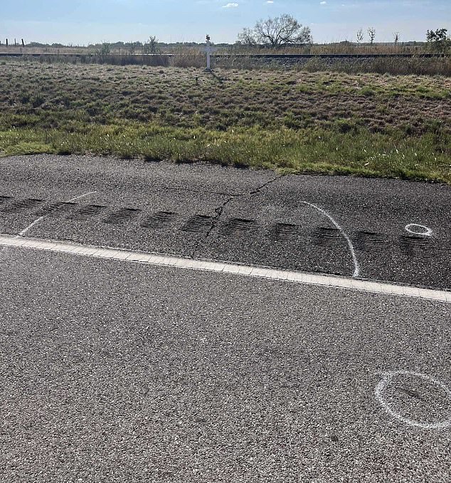 Presgrove's body was found between the two chalk lines, and teeth within the circles. In the background is a memorial set up for the teenager