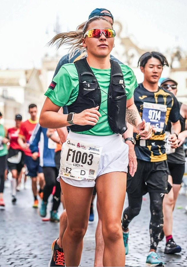 She often filmed herself exercising in her barracks gym giving advice on health and fitness. Pictured: Running the Rome Marathon 2024