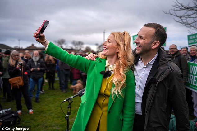 Ms Spencer poses for a selfie with the Green Party's leader Zack Polanski. Mr Polanski has vowed to abolish all private landlords, tax the rich and bring in aggressive rent controls but Ms Spencer appears to be one of those second homeowners herself