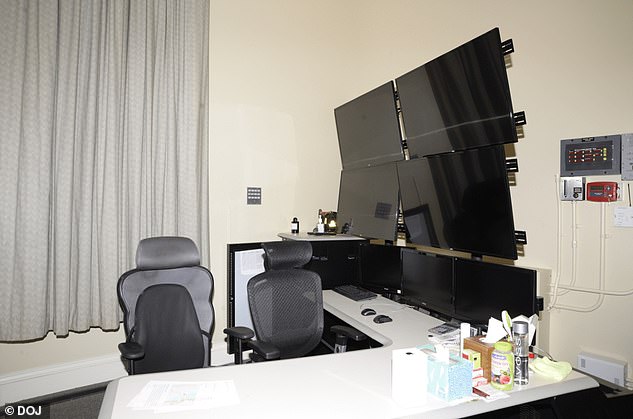 A room at Epstein's home containing a desk with seven monitors