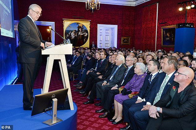 David Stern seen sitting beside the late Queen Elizabeth during Andrew's Pitch@Palace launch at St James's Palace in London in 2014