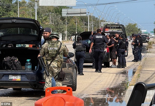 Members of the Mexican Army and state police inspect vehicles in the resort city of Cancun, Quintana Roo, on Sunday