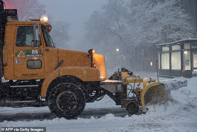 The heavy snow has impacted millions across the East Coast, with travel restrictions in place from Boston (pictured) down to Washington DC