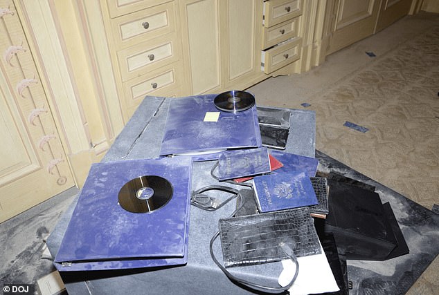 Staff reportedly was hired to open up units in Epstein's name and move files between them. Pictured a items found in his New York City home