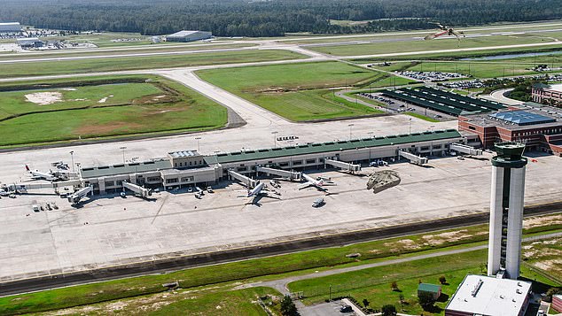 A fire erupted as the runway's grass was set alight by the blown engine as the Delta flight took off the ground at around 6.30pm
