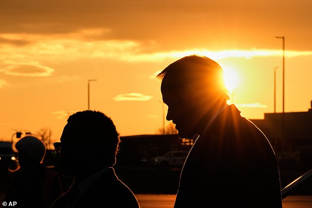 U.S. Secretary of State Marco Rubio, silhouetted against the setting sun, arrives at the Liszt Ferenc International Airport in Budapest