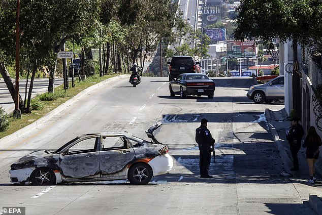 A burning vehicle in Tijuana, Mexico, on Sunday, following the death of Nemesio Ruben Oseguera Cervantes