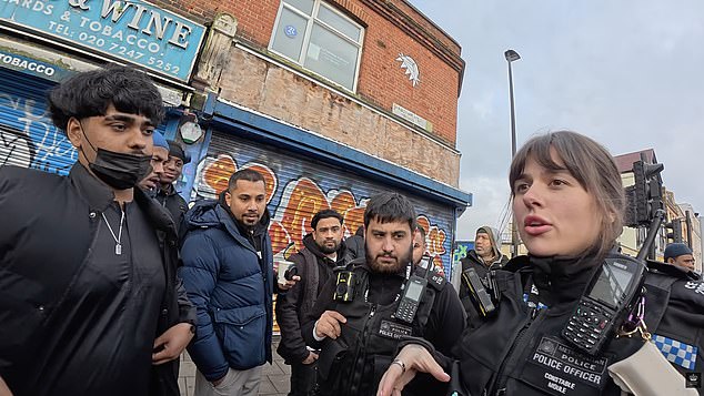 It came just moments before a female Met Police officer had defended the preacher's freedom of speech when a group of males had surrounded her to complain that the evangelist was 'in a Muslim area'