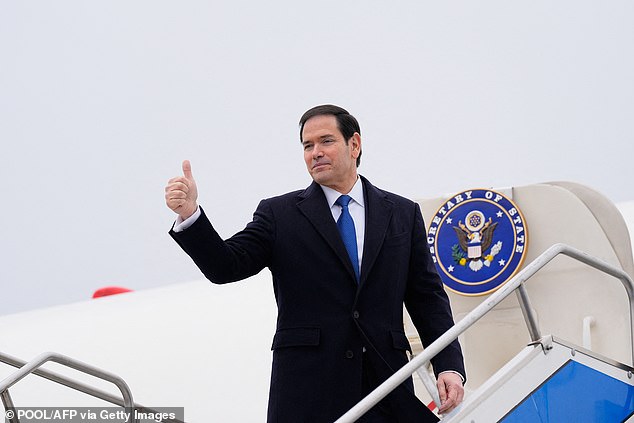 US Secretary of State Marco Rubio gestures as he departs for a foreign trip
