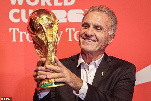 Argentine former footballer Oscar Ruggeri, a member of Argentina's 1986 FIFA World Cup-winning team, unveils the 2026 FIFA World Cup trophy in Montevideo, Uruguay