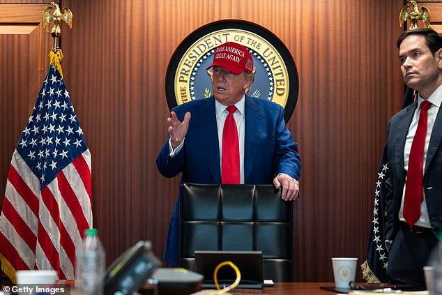 President Donald Trump stands next to Secretary of State Marco Rubio in the Situation Room