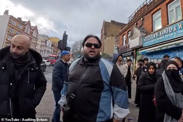 He quips, 'we don't believe in a Jew' in unsavoury and chaotic scenes which were captured on video in Whitechapel Road last week